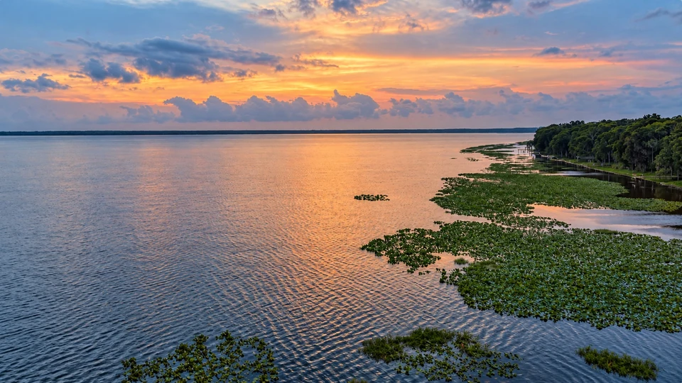 Open water, lily pads and a warm sunset on Lake Lochloosa